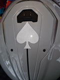 Example of a white reflective ace of spade on top of helmet.
